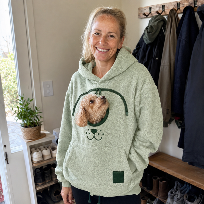 Sophie M. wearing the hoodie with their dog