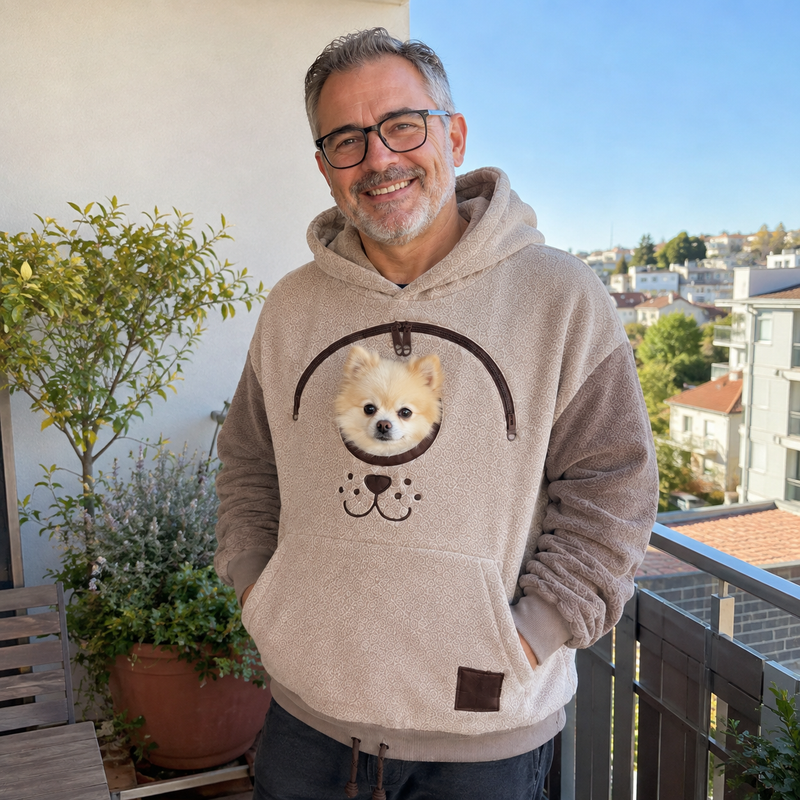 Chris B. wearing the hoodie with their dog